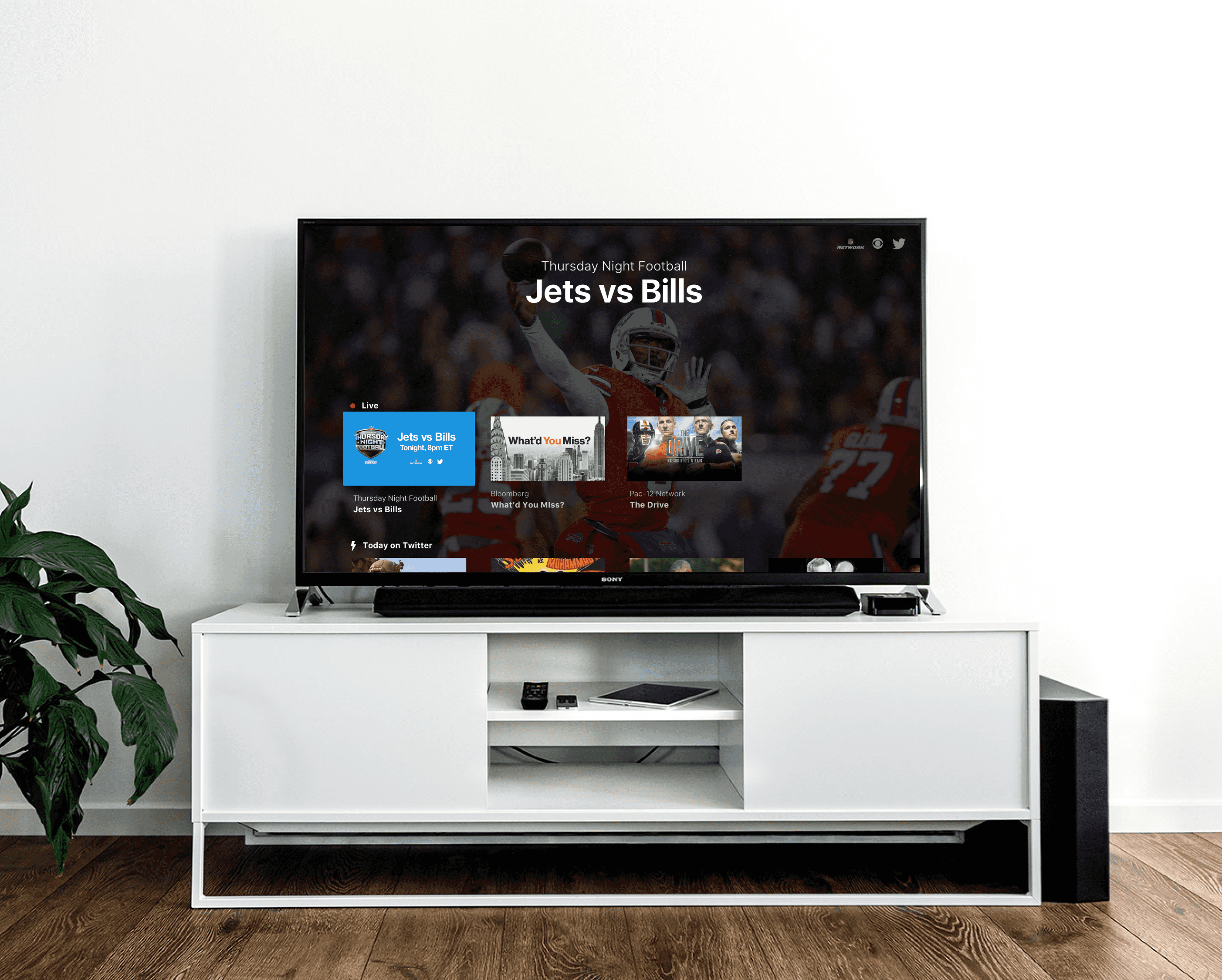 Large TV on TV stand showing the Twitter  (X) TV app