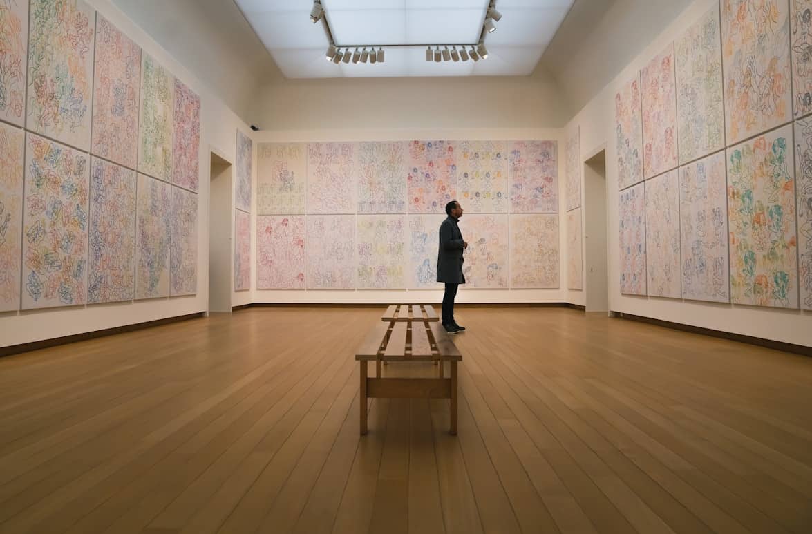 Patron looking at art in a modern gallery