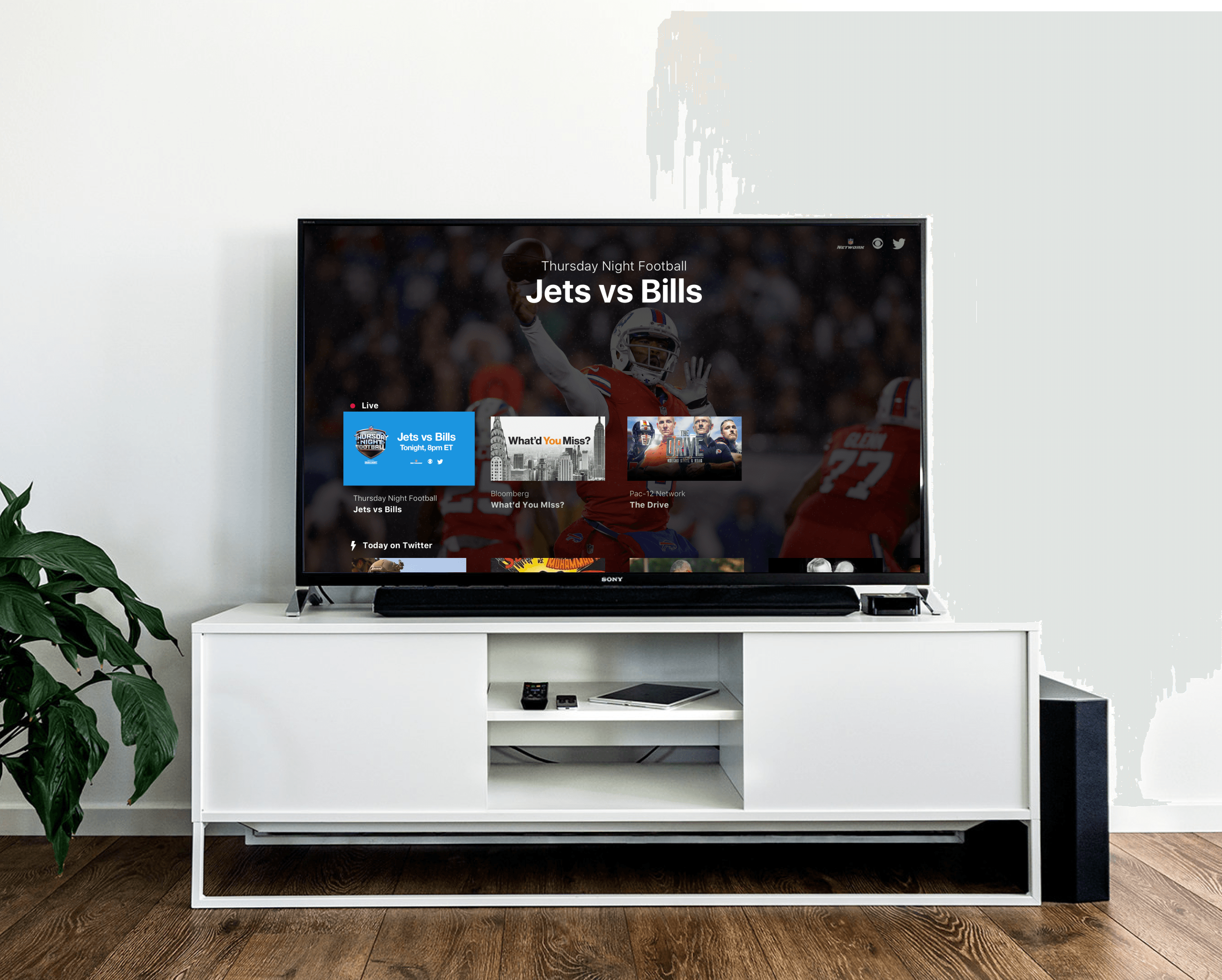 Large TV on TV stand showing the Twitter  (X) TV app