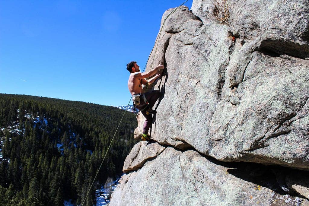 man rock climbing